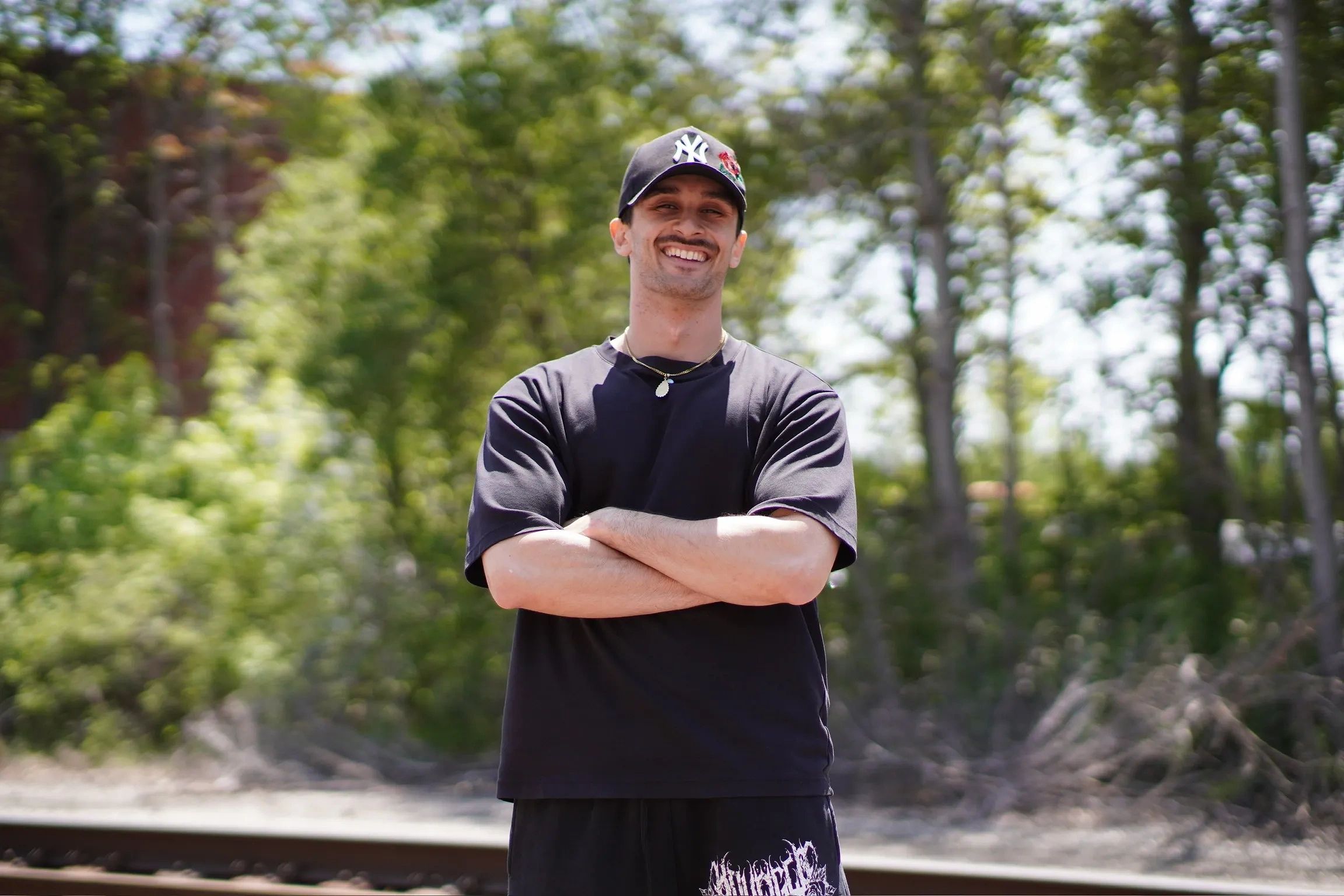 Alex Koulos smiling outdoors